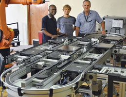 From l: Masters’ students Chibaye Mulubika, Anro le Roux and Professor Anton Basson showcase the TS2-Plus conveyor system.